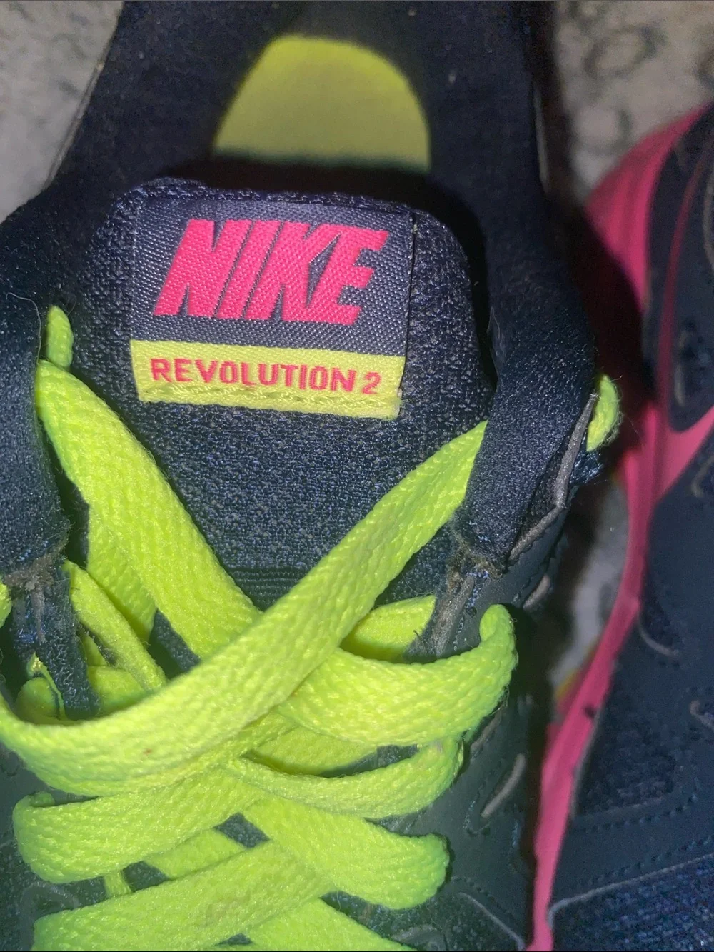 Nike women’s Navy Sneakers with Neon Green Laces and Pink Accents
